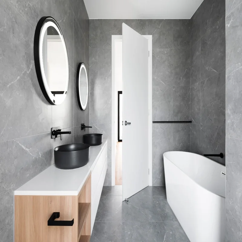 Modern bathroom with rount lit up mirrors